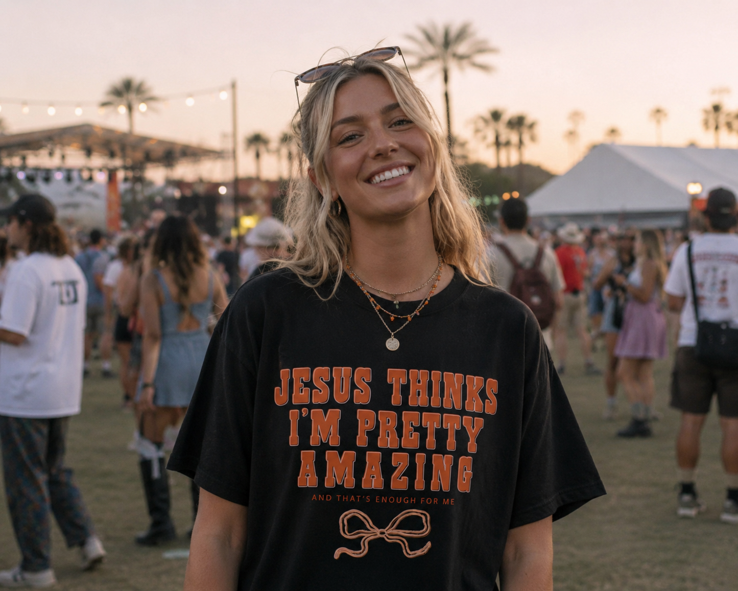 Woman wearing a black t-shirt with text at a festival.